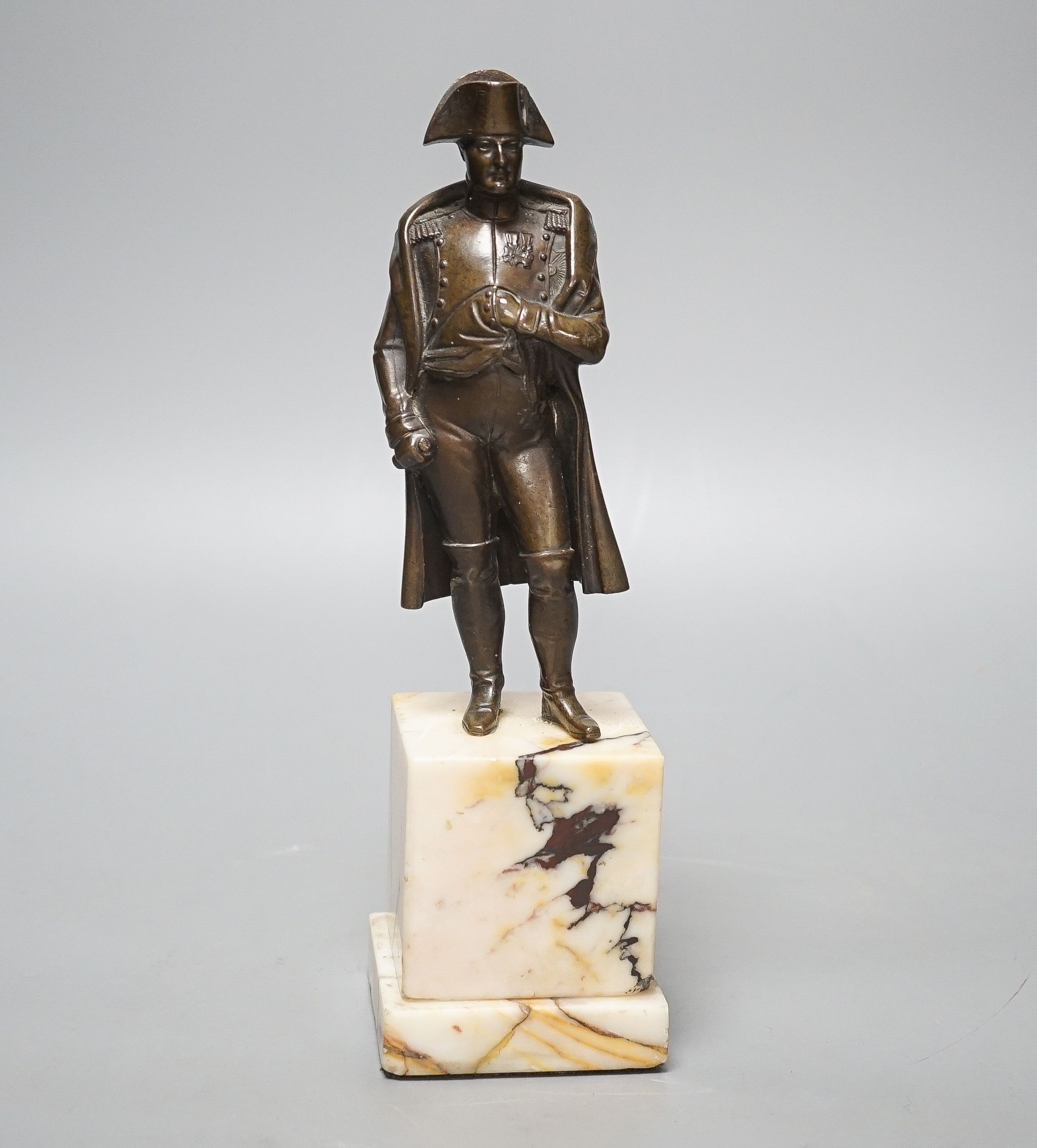 A bronze figure of Napoleon on marble base and two related prints ‘Porto Ferrajo’ and ‘Grand Entry of the Allied Sovereigns into Paris’ bronze 24cm tall